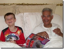 Manu and Grandpa in bed - laughing 2007